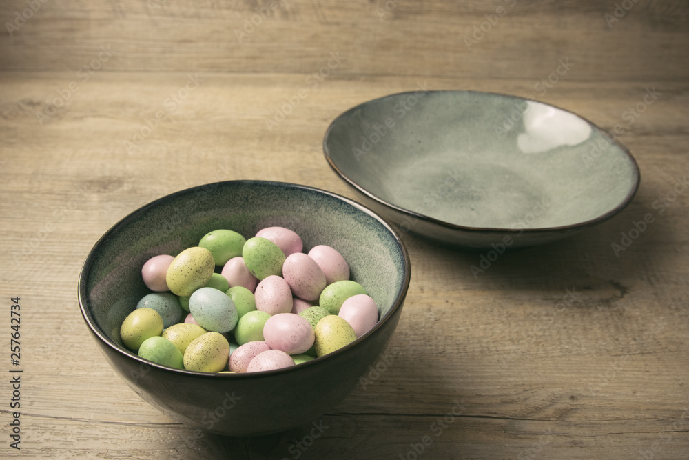 Speckled chocolate easter eggs in a ceramic bowl. Speckled chocolate easter eggs in a ceramic bowl.