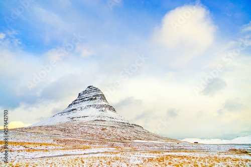 View of the Kirkjufell Mountain in Iceland on a cloudy day in winter. photo