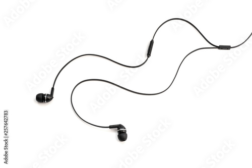Headphones for listening music and sounds on portable devices on a white background. Ear plugs. Earflaps for a mobile phone. Headset from two earpieces. Playing music