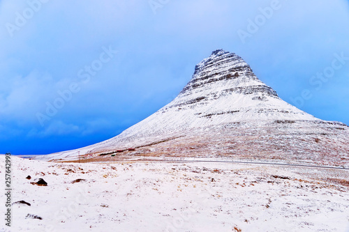 View of the Kirkjufell Mountain in Iceland on a cloudy day in winter. photo