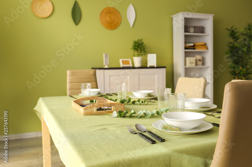 Table served for dinner in interior of dining room