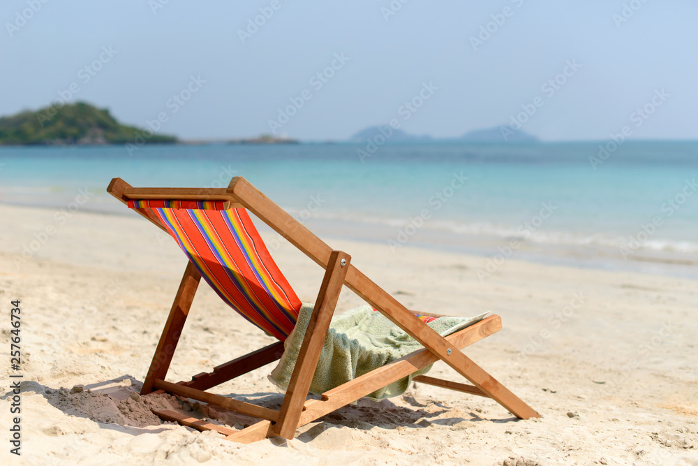 Chaise lounge on the tropical beach at sunny summer day. Travel vacation relax concept. Chaise lounge on the tropical beach at sunny summer day. Travel vacation relax concept.