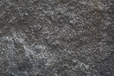 Textured background of gray coarse-grained plaster.