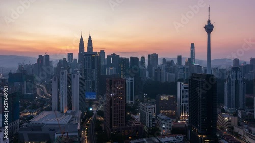 4K Cinematic Sunrise Time Lapse Footage of Kuala Lumpur city skyline from the west side of the Malaysian capital.