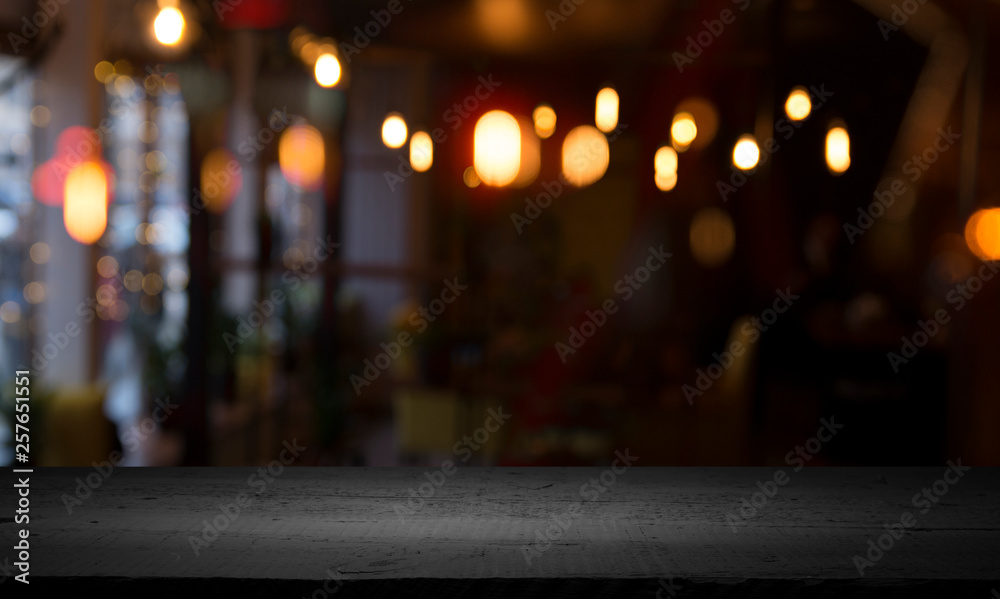 Fototapeta premium blurred background of bar and dark brown desk space of retro wood