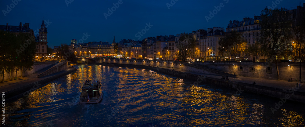 Night view from Seine River in Paris France