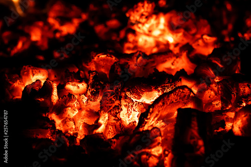 Hot coals in fireplace, fire background, close-up, macro.