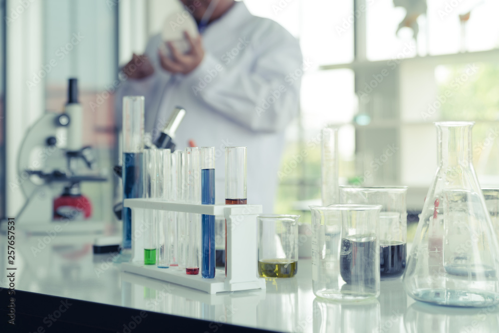 Fototapeta premium kids with test tubes studying chemistry