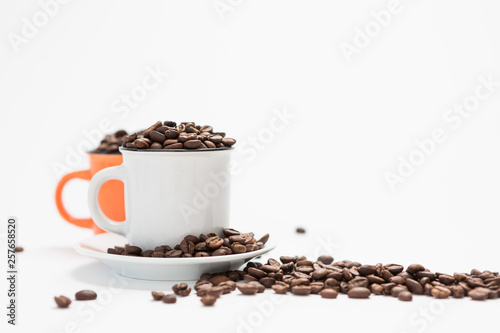 Coffee Cups Filled with Coffee Beans on a White Background Concept with Copy Space