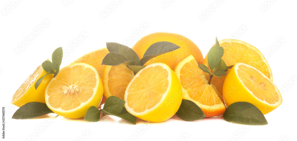Fresh lemons and sliced lemon with leaves on a white isolated background. close-up