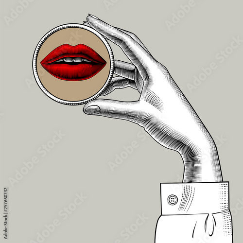 Female hand holding in fingers a round small mirror with a reflection of her eye. Vintage engraving stylized drawing. Vector illustration