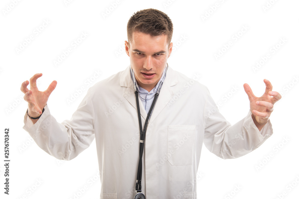 Portrait of young handsome doctor looking very mad Portrait of young handsome doctor looking very mad