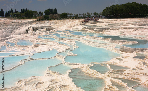 A breathtaking view on Pamukkale natural site of hot springs and travertines (terraces of carbonate minerals)/southwestern Turkey, Denizli Province, River Menderes valley /Unesco world heritage site  #257671346