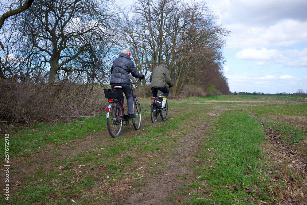 senior couple cycling in the countryside