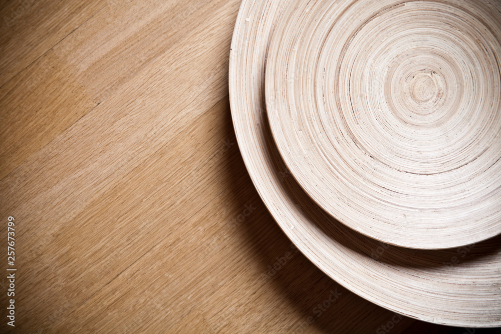 Two bamboo bowls on wooden background. Two bamboo bowls on wooden background.