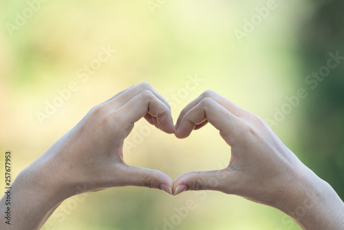 Heart hands sign, Close up. © May_Chanikran