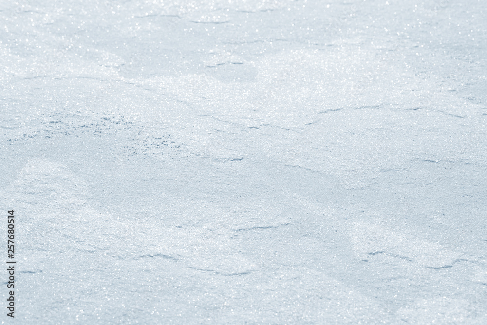 Fresh snow background texture. Winter background with snowflakes and snow mounds. Snow lumps.