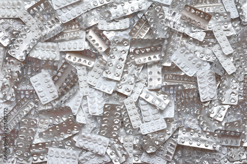 Photography Many empty pill sheets on white background, drug overdose, misuse or addiction c