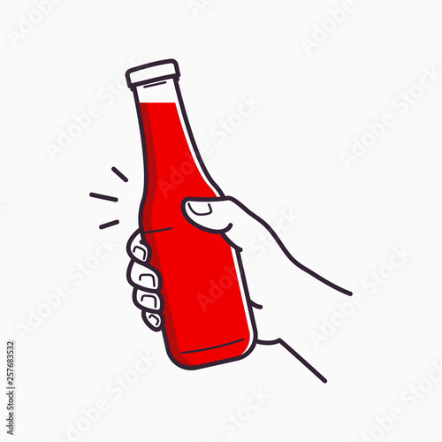 Hand hold ketchup bottle. Holding a tomato ketchup