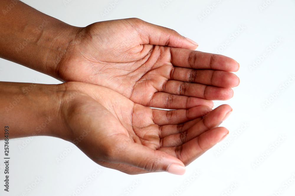 Black African hands out reaching, begging, showing with palms up Black African hands out reaching, begging, showing with palms up