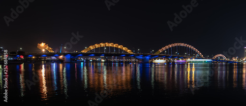 Night view landscape of Dragon  bridge across river at Da Nang,  Vietnam. photo