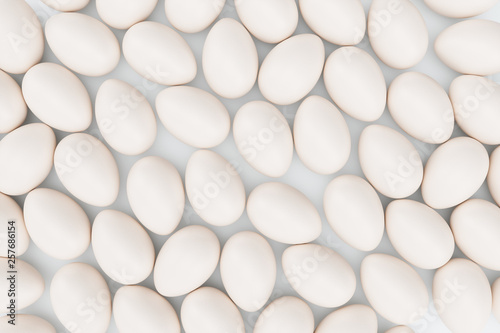 Fototapeta Naklejka Na Ścianę i Meble -  White eggs. Background of eggs. Concept happy easter. Eggs as a symbol of the holiday. Background for healthy food, easter, eggs food production. 3D illustration