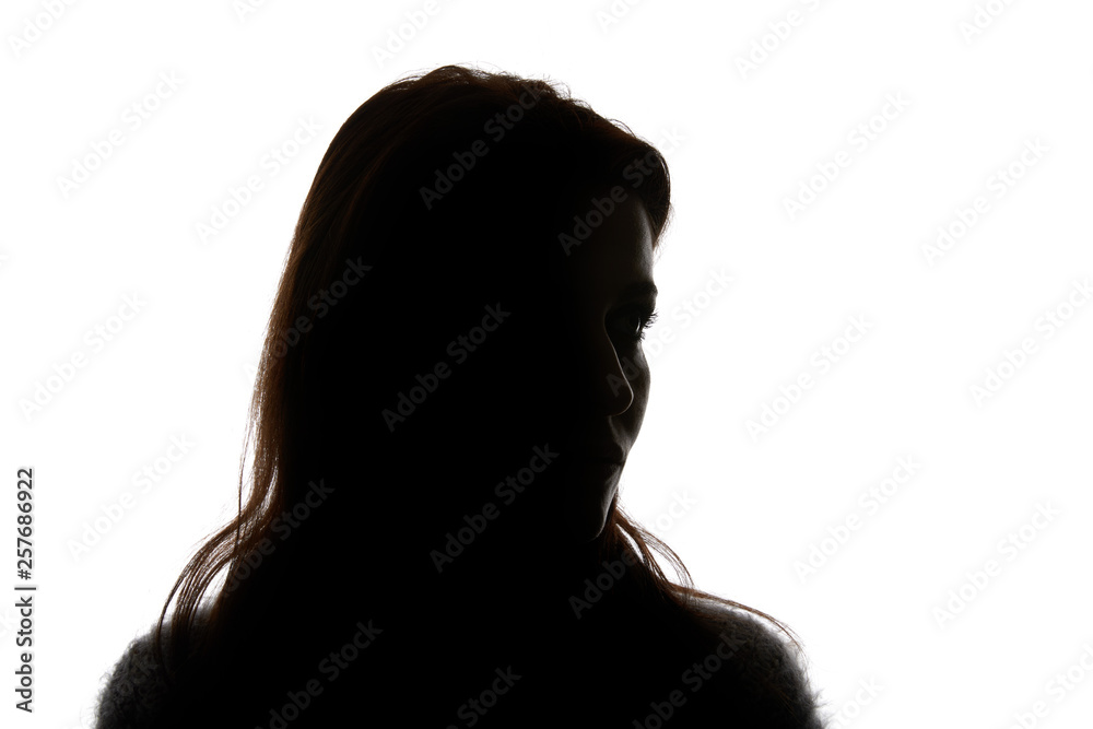 Silhouette of woman looking away isolated on white