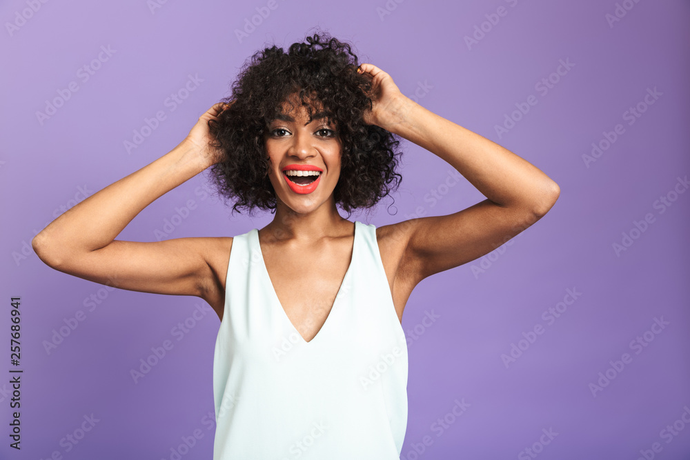 Portrait of a cheerful african woman wearing dress Portrait of a cheerful african woman wearing dress