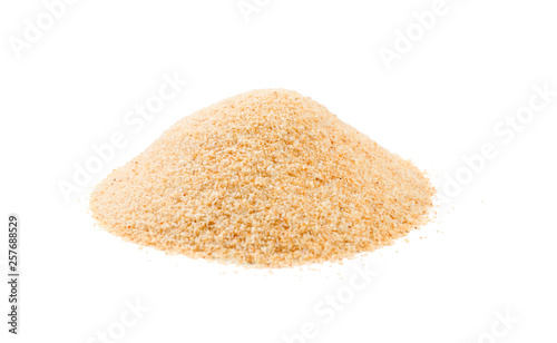 dried milled ground garlic heap isolated on white background. front view