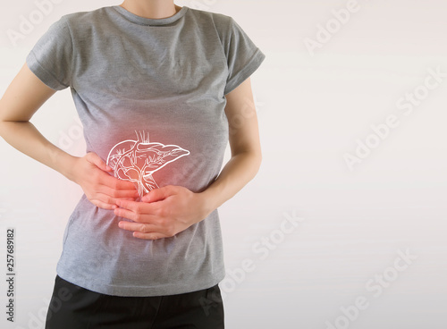 Digital composite of highlighted painful  liver of woman photo
