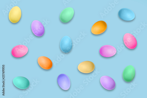Pastel colored Easter eggs on blue background  Easter pattern
