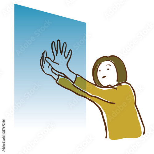 壁を押す女性