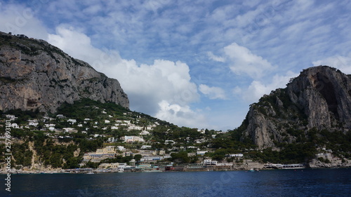 A panorama across the breakwater of the harbour of Marina Grande with Mount Solaro and Anacapri in the distance on the island of Capri  Italy