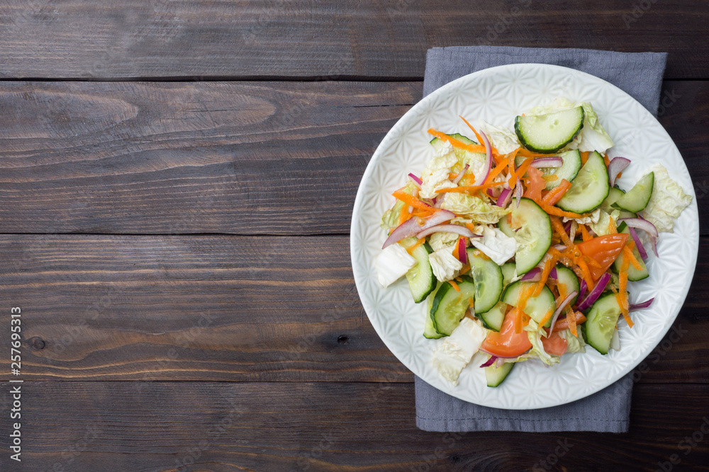 Vegetarian salad of raw fresh vegetables in a plate. Concept healthy eating Copy space Vegetarian salad of raw fresh vegetables in a plate. Concept healthy eating Copy space