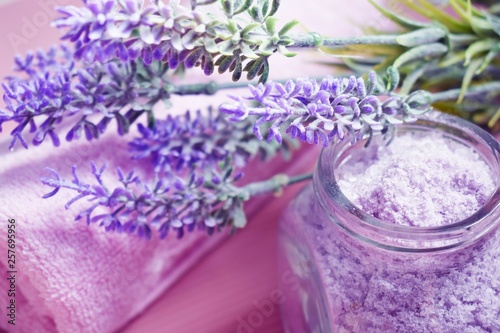 Bath salt with the scent of lavender on a pink background.