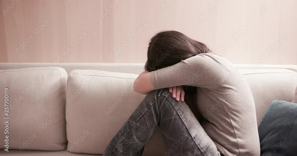 woman feel depressed on sofa