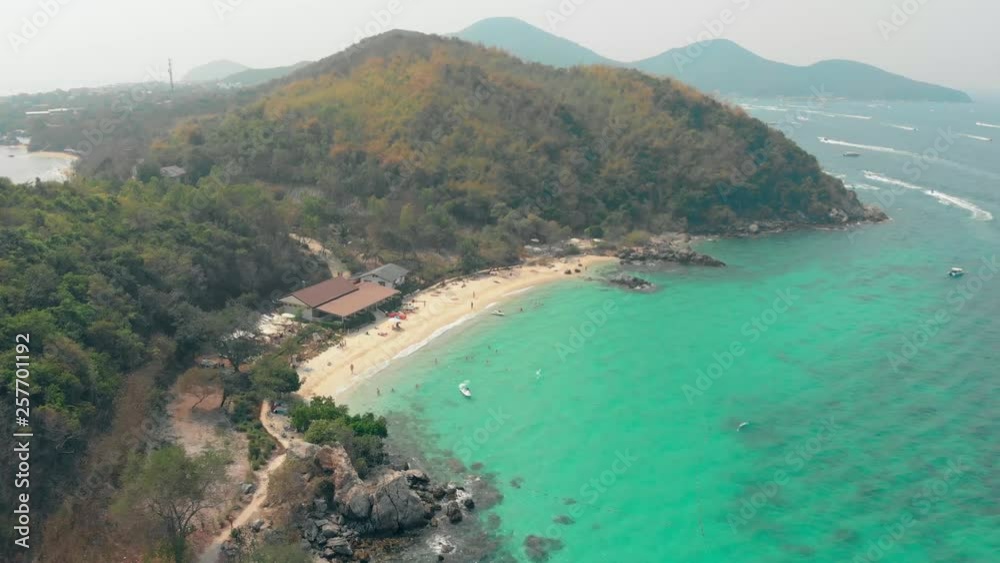 tourist complex on small island covered with green thick tropical forest with beach among turquoise ocean aerial view tourist complex on small island covered with green thick tropical forest with beach among turquoise ocean aerial view