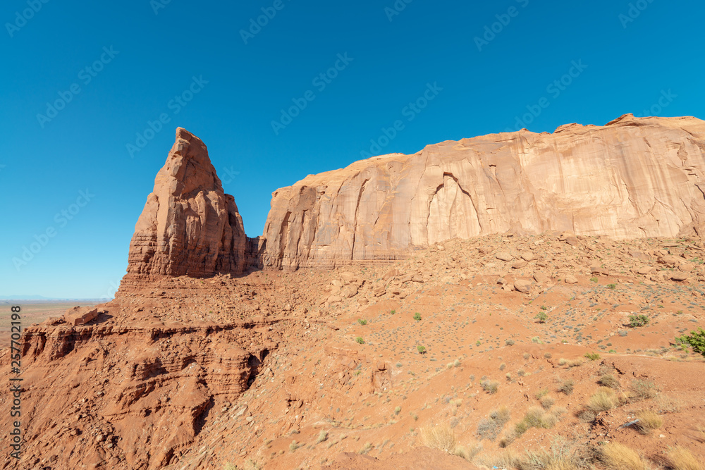 Fototapeta premium Red rocks of Monument Valley on a clear summer day