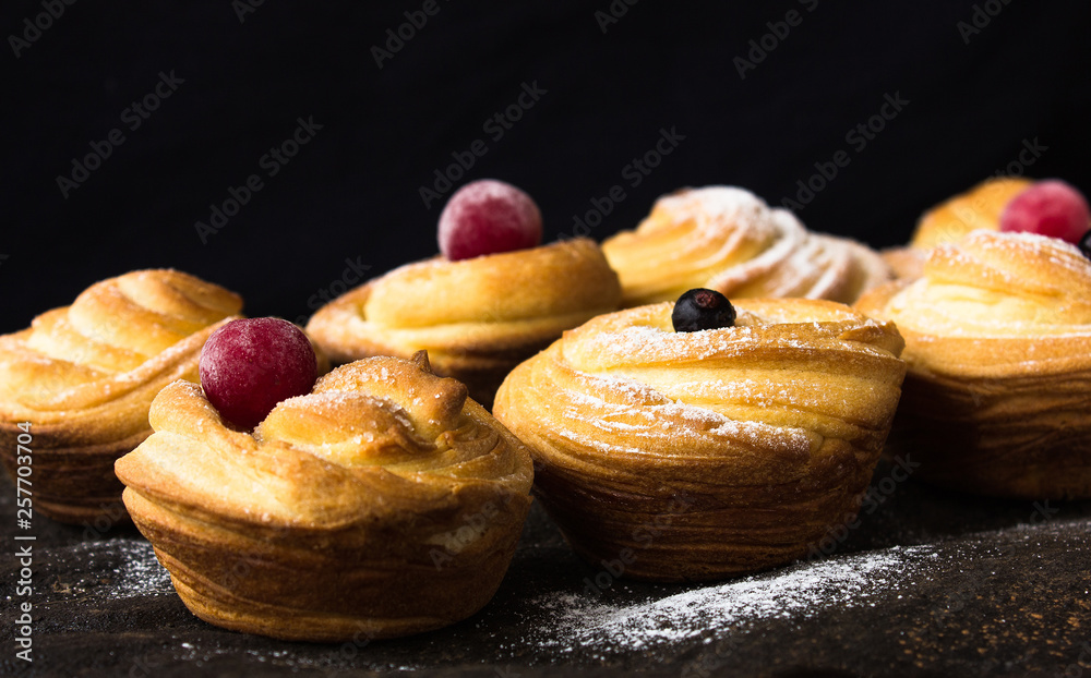 Modern fashionable pastries - scones cruffins (puffmaffin) a mixture of a croissant and maffin