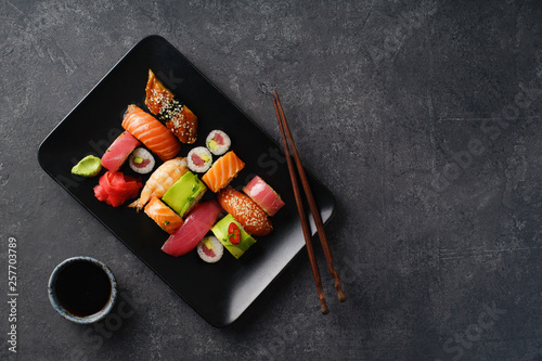 Overhead image of variety of sushi and rolls served on a plate. Shrimp, unagi, crab, salmon and tuna