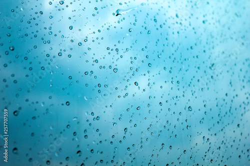 Raindrops on the window show the weather in the rainy season. 