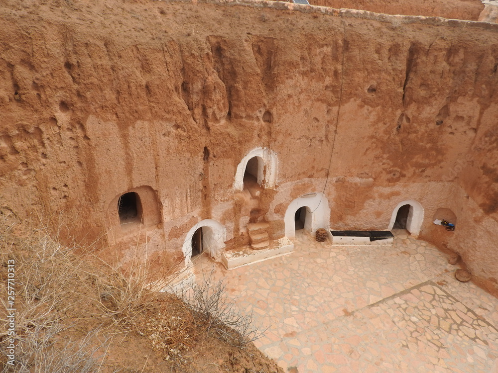 Underground troglodytes caves of the Berbers in the Sahara desert, Matmata, Tunisia, Africa, on a clear day.