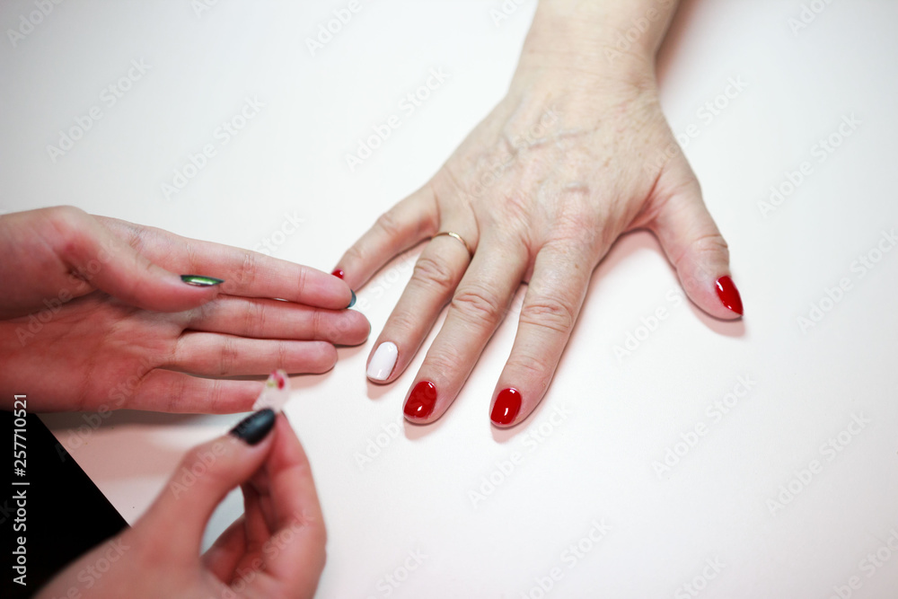 manicure for an elderly woman. the beauty of old age. age skin