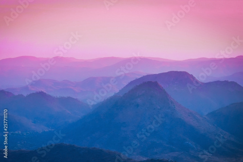 Beautiful blue pink sunset sky at the mountains landscape. Mountain Background.