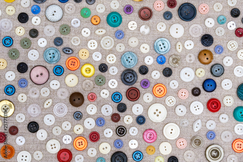 background - multicolored buttons on the fabric
