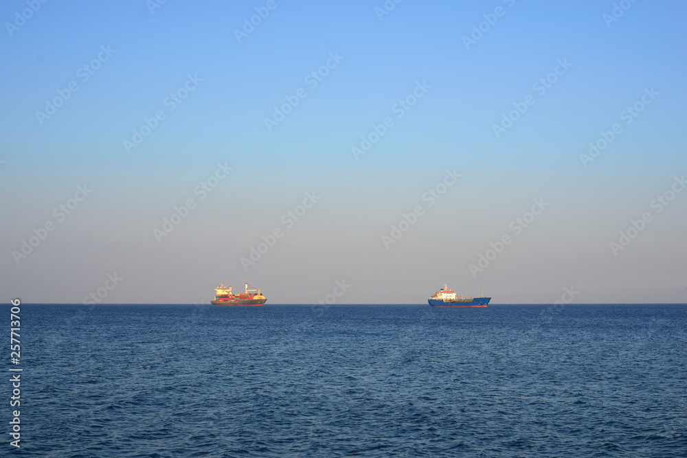 cargo ships on the horizon