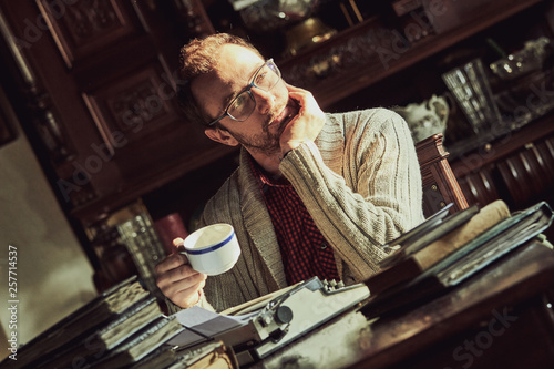 Wallpaper Mural Young man writing on old typewriter. Torontodigital.ca