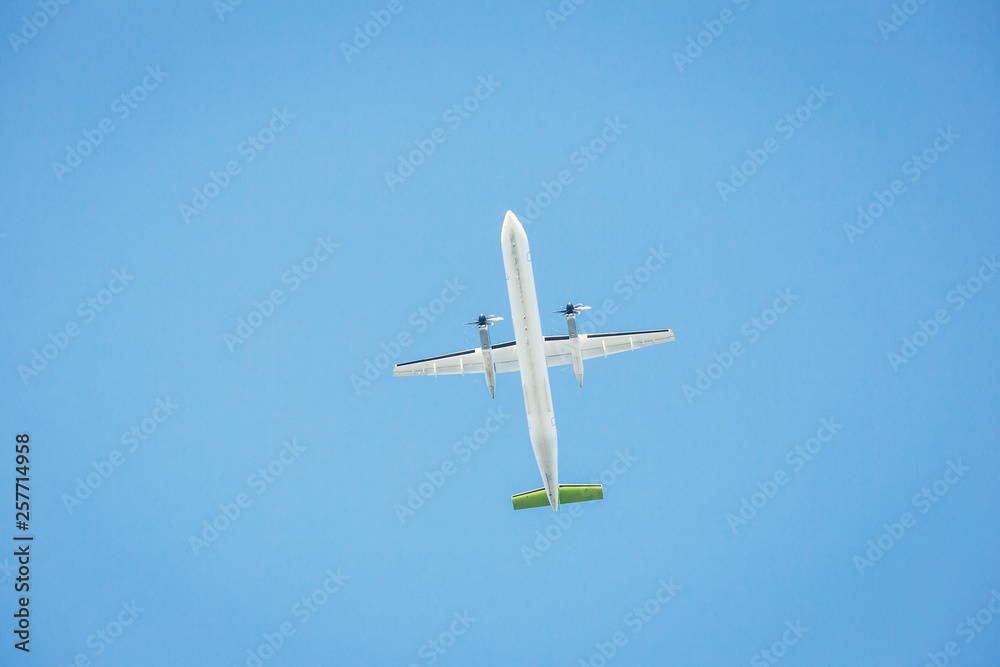 Passenger airplane isolated against the blue sky. Front view. Passenger airplane isolated against the blue sky. Front view.