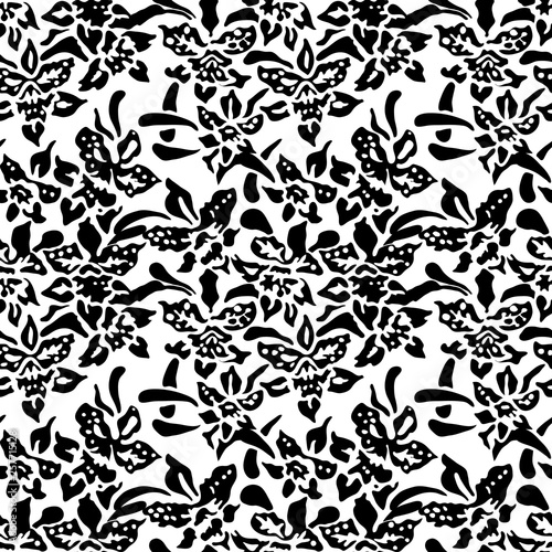 Seamless woodblock printed floral pattern. Traditional oriental ornament of Indonesia, with orchids, black on white background. Textile design.