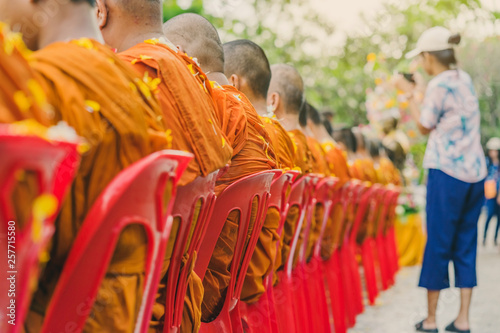 People pouring water to Buddhist Monk and gives blessing in Thailand Songkran annual festival in Buddhist temple.